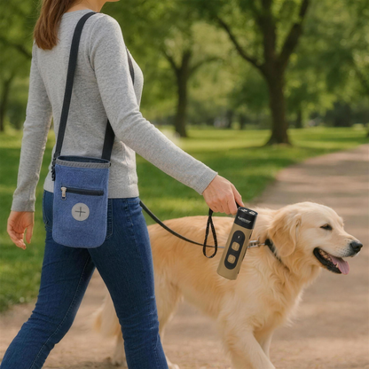 Woman walking a golden retriever in the park with the blue PawPouch™ walking bag and a brown QuietPaws™ on the lead